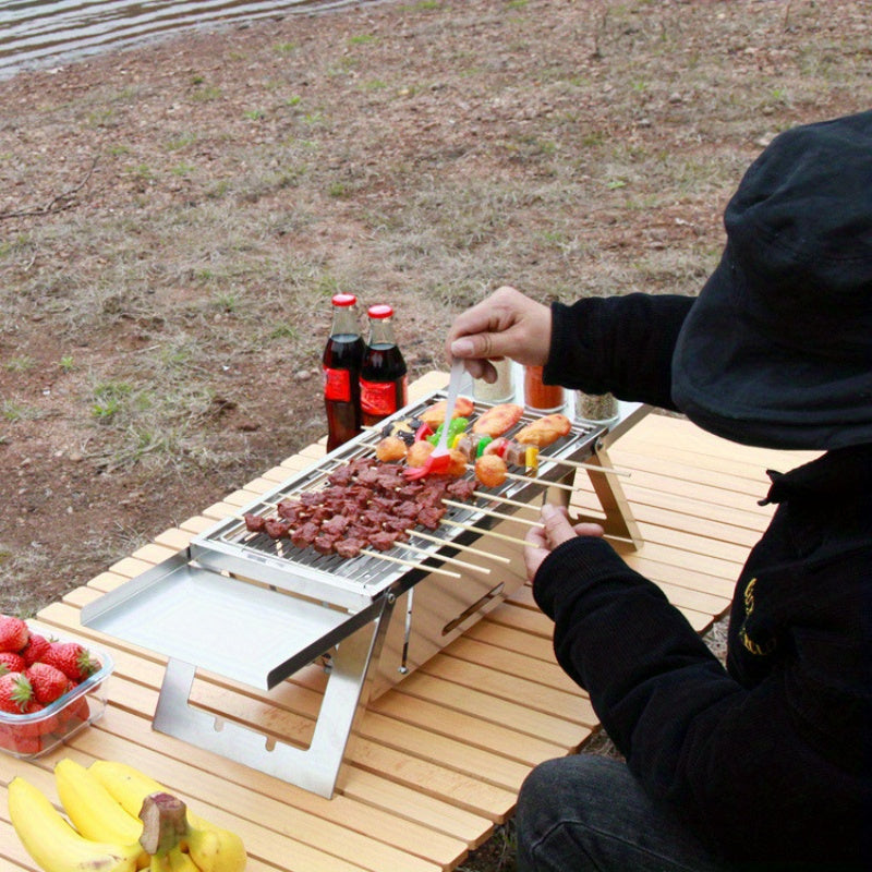 Hopfällbar Kolgrill i rostfritt stål för utomhusbruk - portabel och hållbar finns hos Aktivcamping